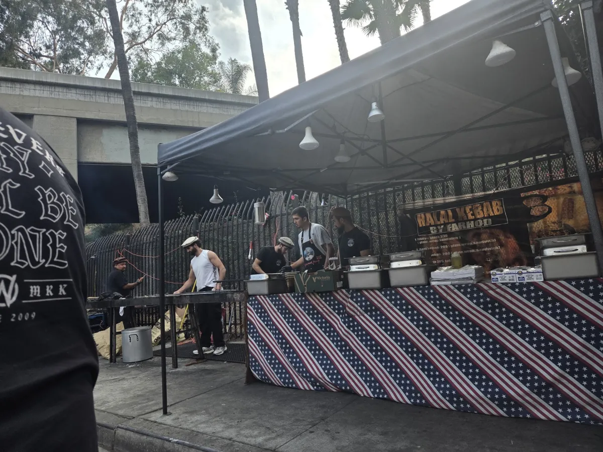Farhod's crew at the black canopy under the freeway